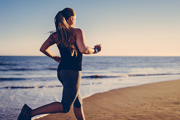 Personal Training Wherever and Whenever Woman Running on the Beach for Cardiovascular Exercise Outdoors