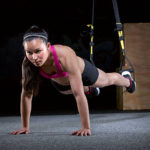 TRX Training a woman in a TRX Suspension Training Push Up