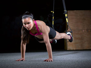 TRX Training a woman in a TRX Suspension Training Push Up